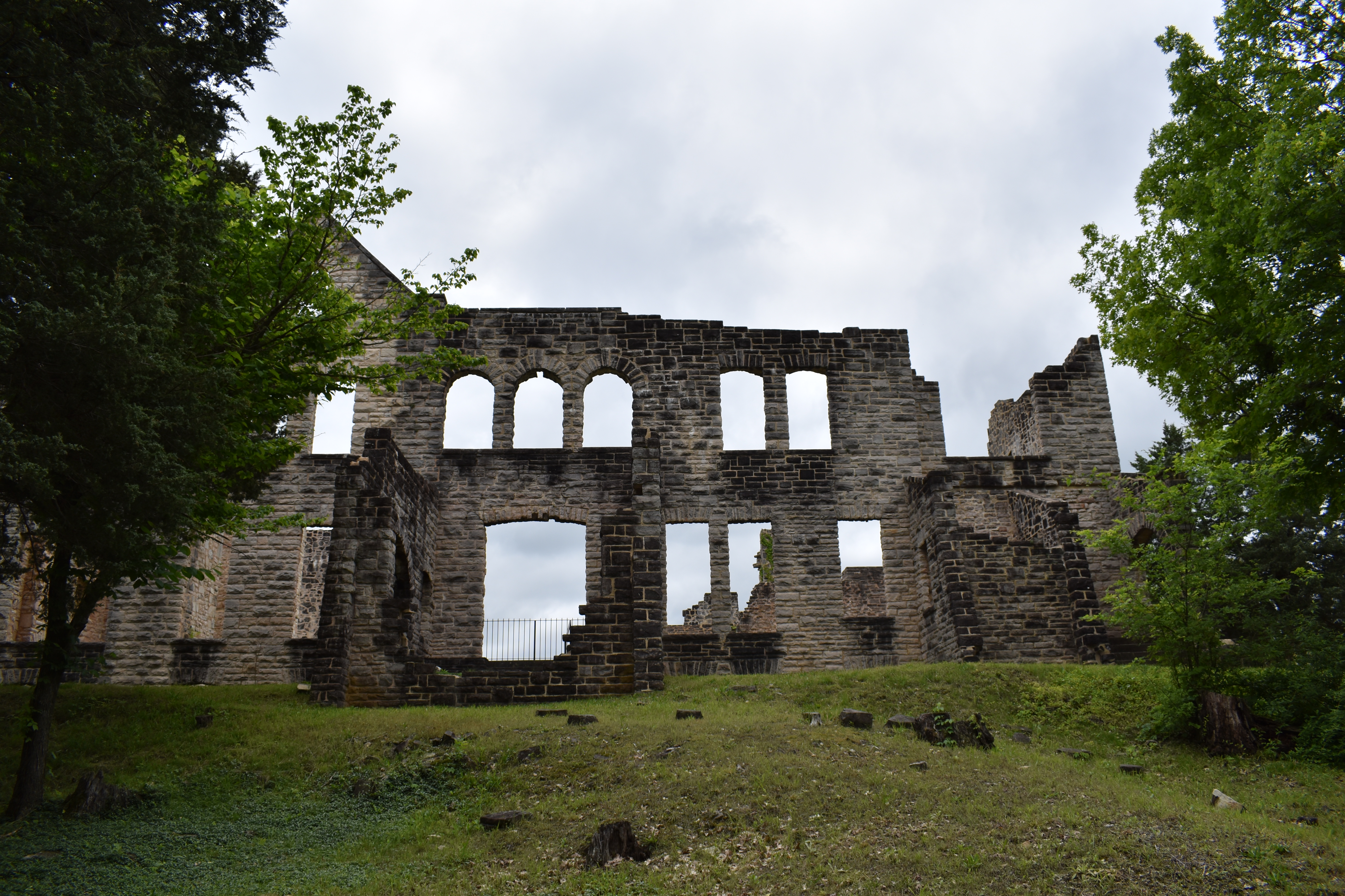 The back of the castle with stone walls and arches at Ha Ha Tonka Castle Ruins