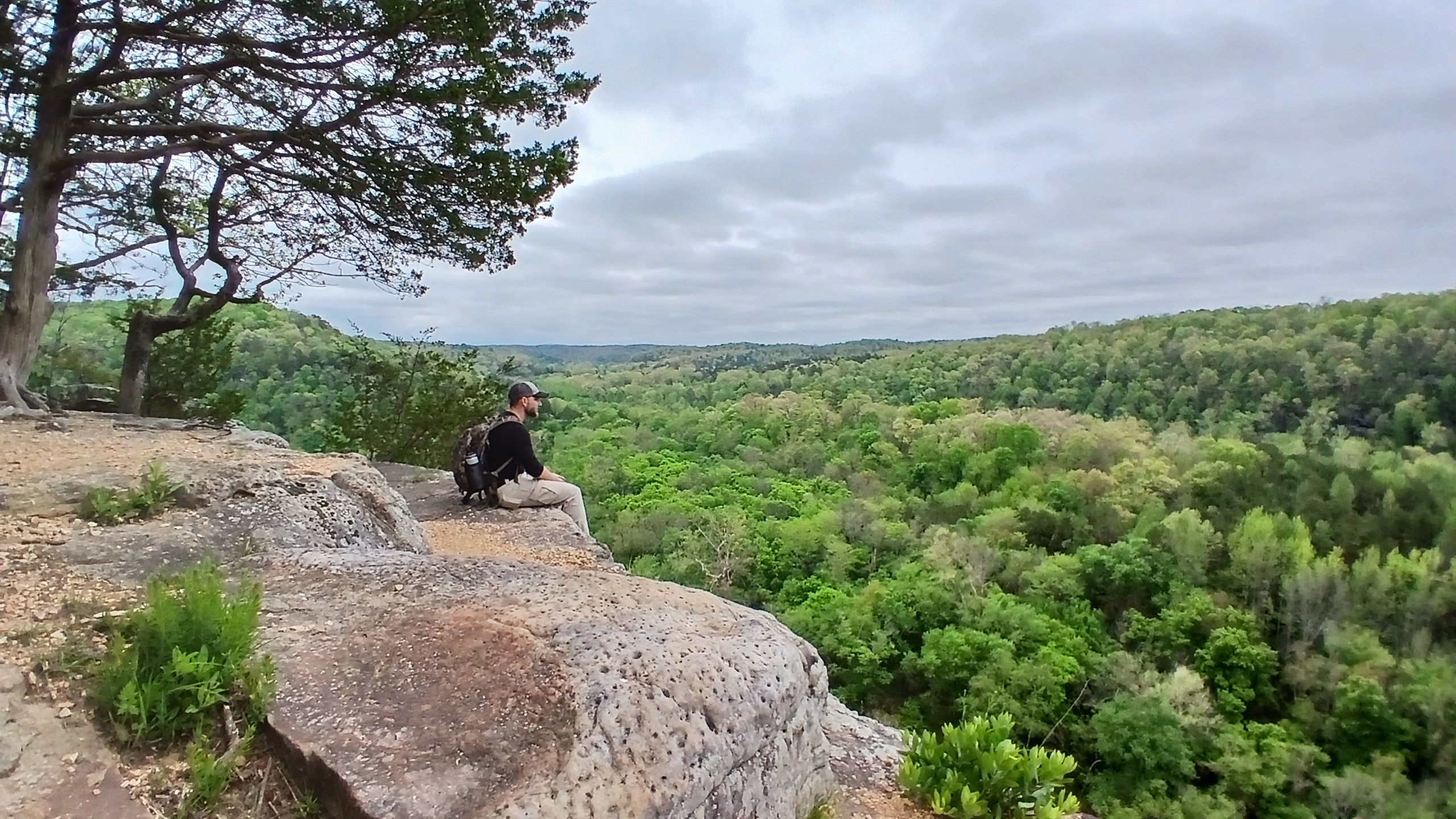 Relaxing on a cliffside overlook during the trip